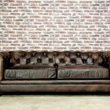 The classic Chesterfield sofa offers a touch of grandeur and elegance to any room